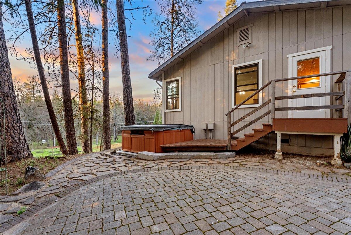 5621 Saw Mill Road Placerville, CA 95667 - Photo 47 of 75 a backyard of a house with barbeque oven table and chairs