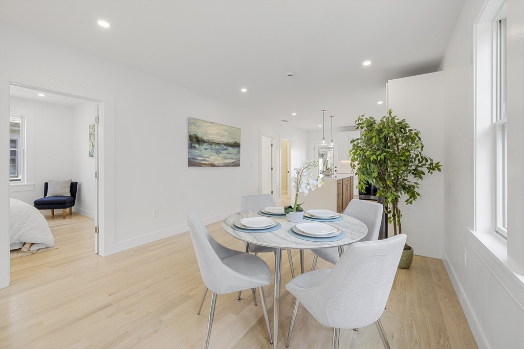 39 Seven Pines Avenue, Unit 39 Cambridge, MA 02140 - Photo 11 of 42 a view of a dining room with furniture and wooden floor
