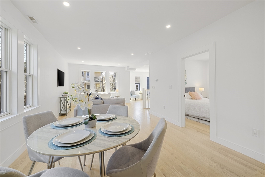 39 Seven Pines Avenue, Unit 39 Cambridge, MA 02140 - Photo 15 of 42 a open dining room with furniture and wooden floor