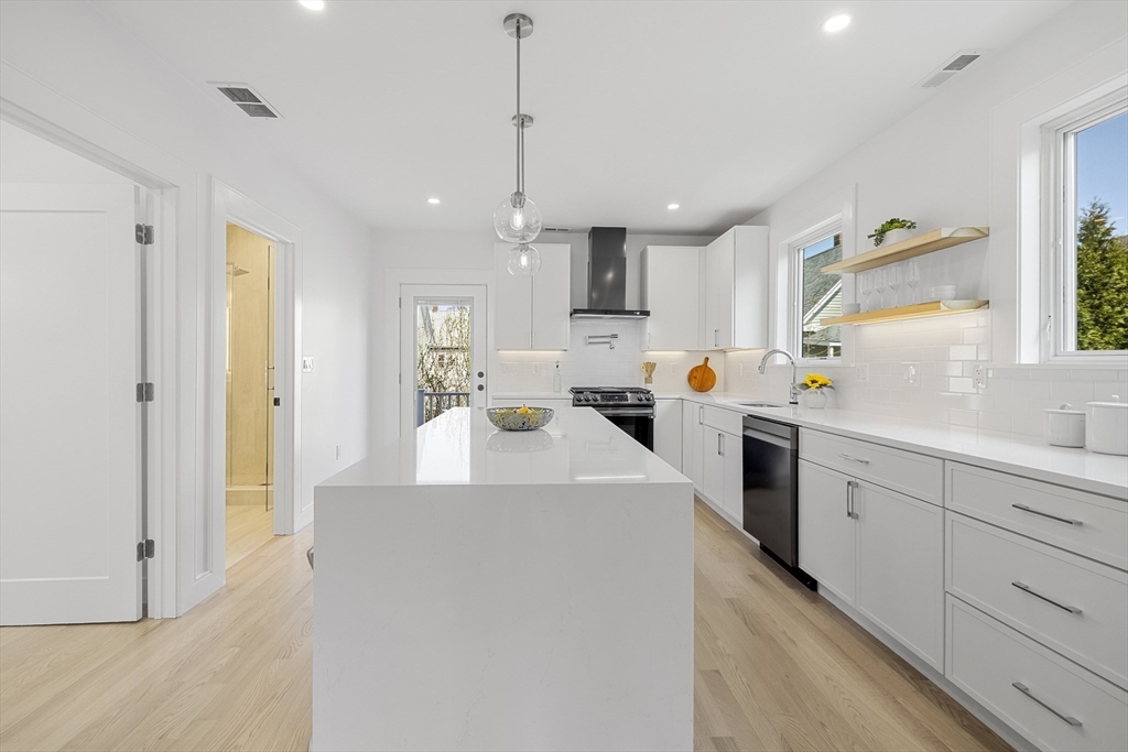 39 Seven Pines Avenue, Unit 39 Cambridge, MA 02140 - Photo 21 of 42 a kitchen that has a lot of counter space and a sink
