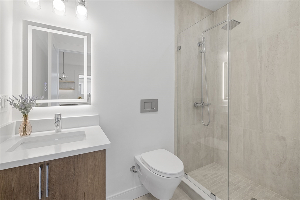 39 Seven Pines Avenue, Unit 39 Cambridge, MA 02140 - Photo 22 of 42 a bathroom with a sink toilet and shower