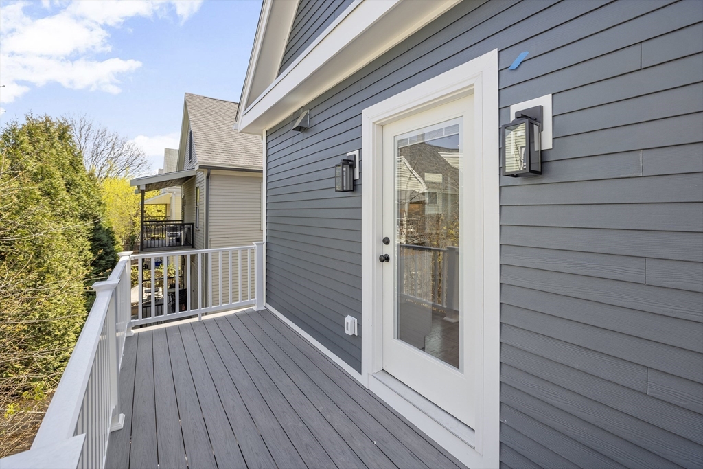 39 Seven Pines Avenue, Unit 39 Cambridge, MA 02140 - Photo 25 of 42 a view of a house with wooden floor