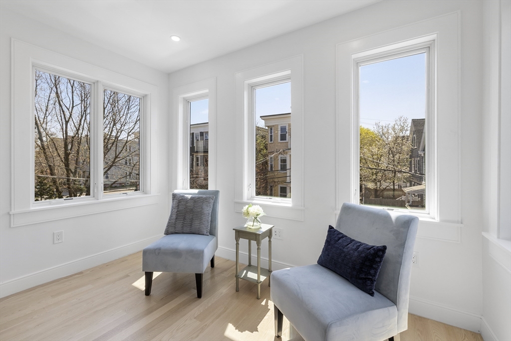 39 Seven Pines Avenue, Unit 39 Cambridge, MA 02140 - Photo 28 of 42 a living room with furniture and a window