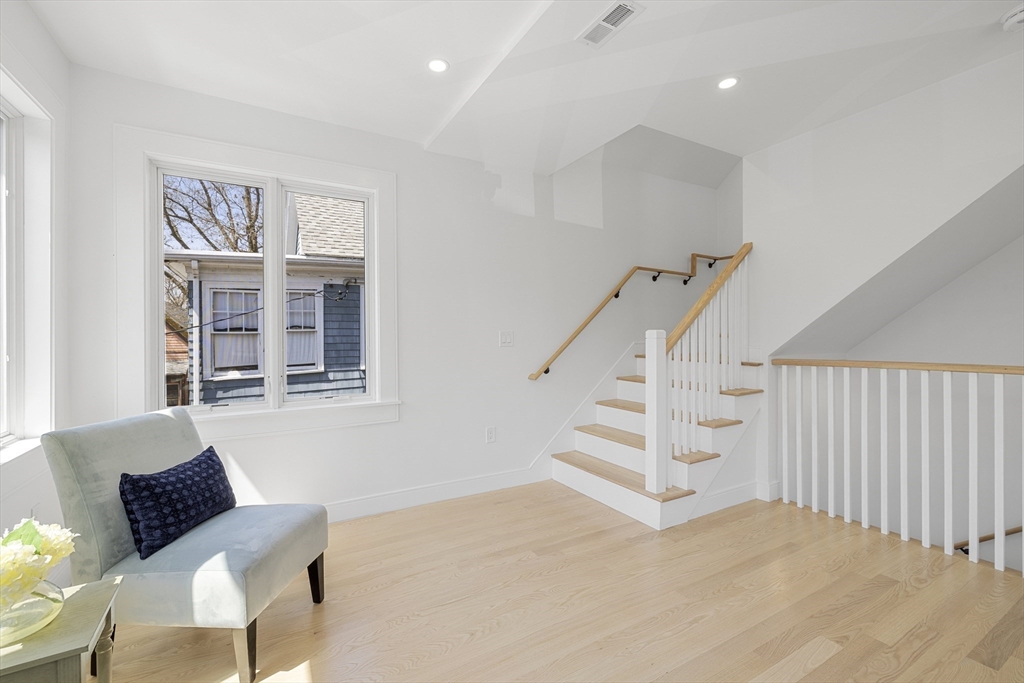 39 Seven Pines Avenue, Unit 39 Cambridge, MA 02140 - Photo 30 of 42 a view of a livingroom with furniture and staircase