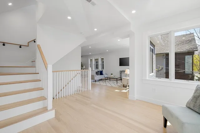 a view of a livingroom with furniture and a window
