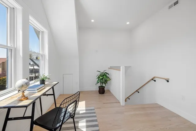 a workspace with furniture and a potted plant