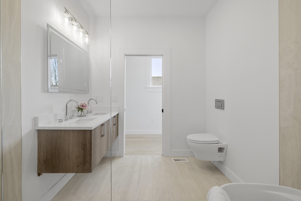 39 Seven Pines Avenue, Unit 39 Cambridge, MA 02140 - Photo 37 of 42 a bathroom with a sink toilet and shower