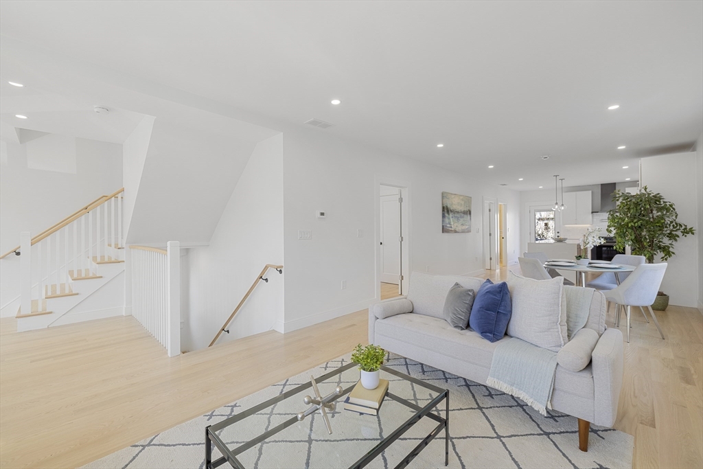 39 Seven Pines Avenue, Unit 39 Cambridge, MA 02140 - Photo 9 of 42 a living room with furniture and white walls