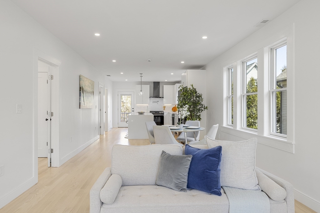 39 Seven Pines Avenue, Unit 39 Cambridge, MA 02140 - Photo 10 of 42 a living room with furniture and a large window