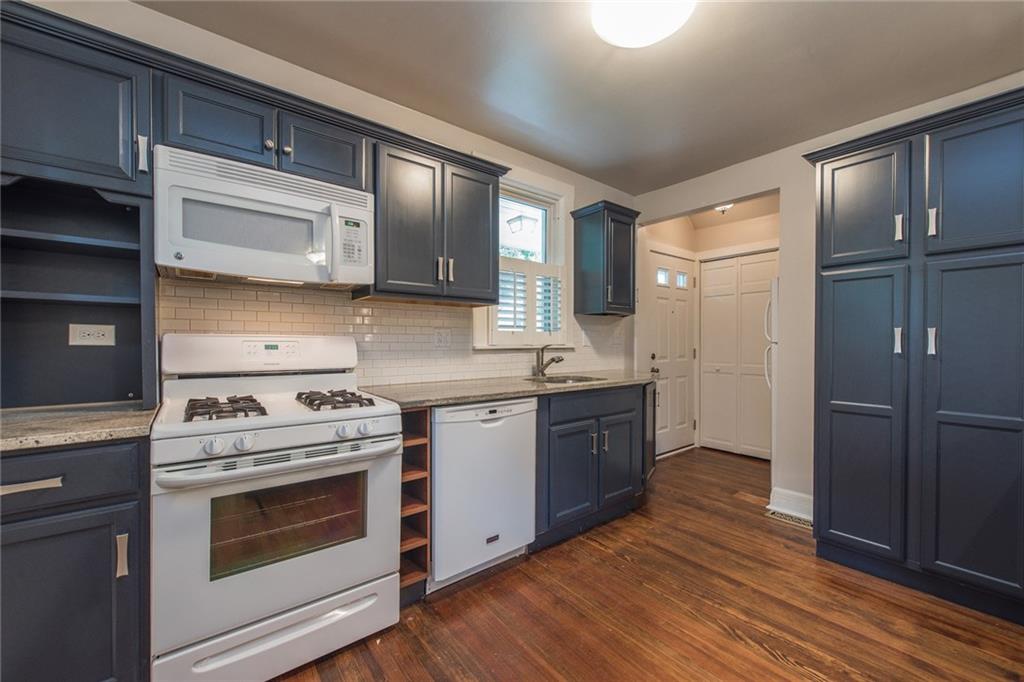 214-216 Pine Road Sewickley, PA 15143 - Photo 4 of 25 First floor kitchen with granite counter tops and gas stove