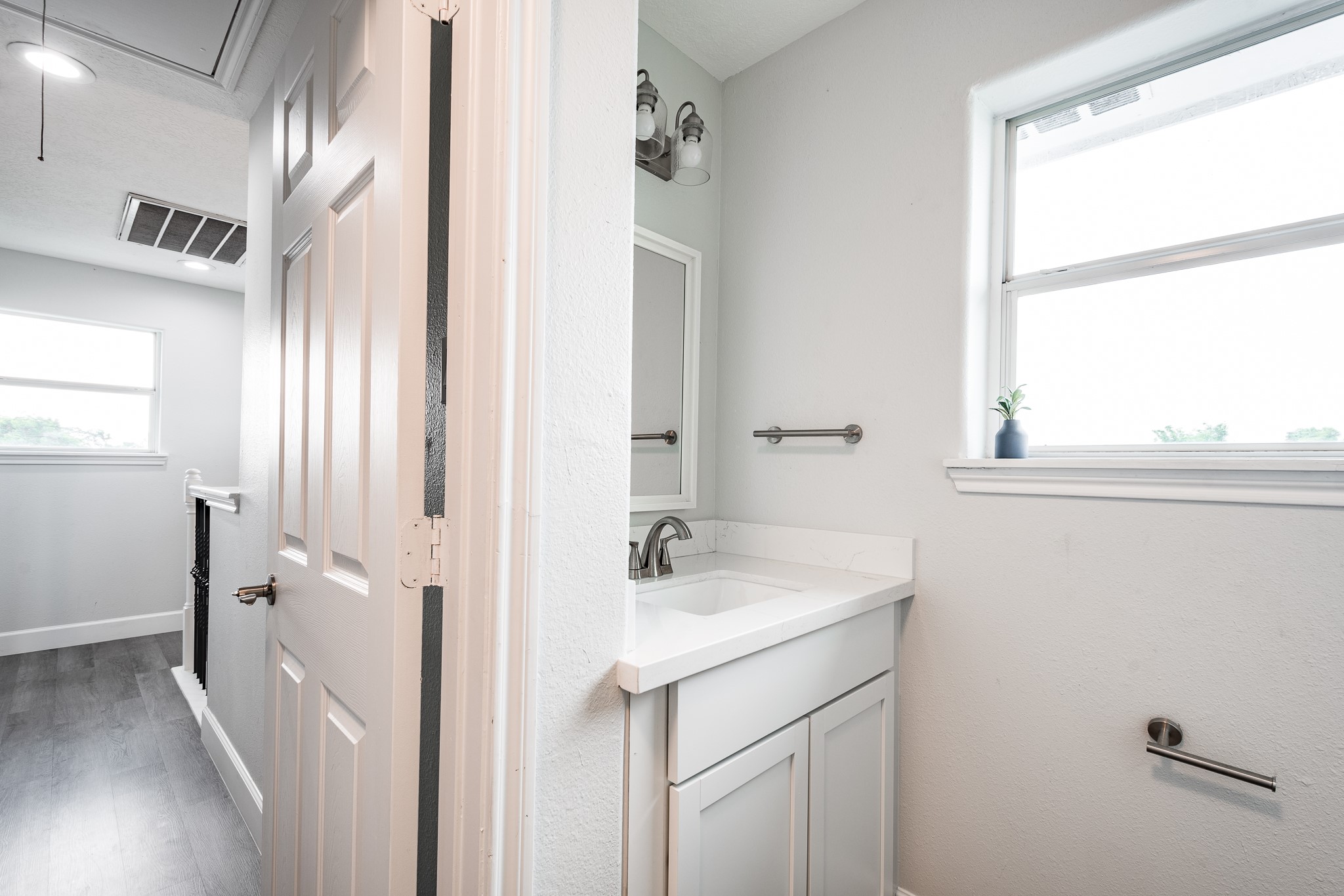 9026 McGallion Road Houston, TX 77022 - Photo 12 of 34 a bathroom with a sink and a mirror