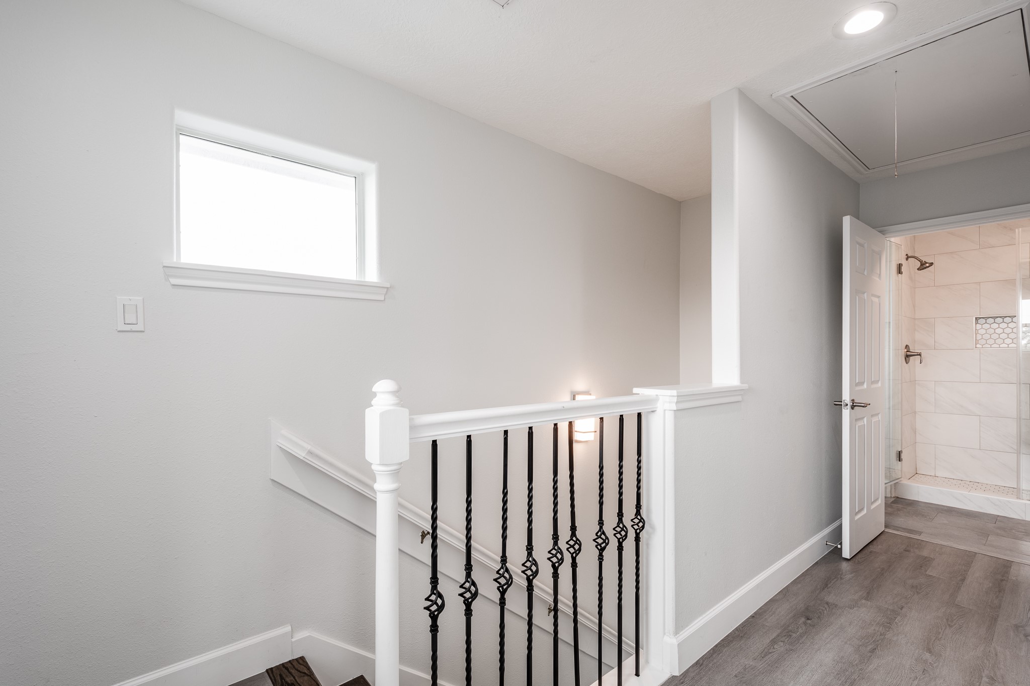 9026 McGallion Road Houston, TX 77022 - Photo 14 of 34 a view of a hallway with a white door and a window