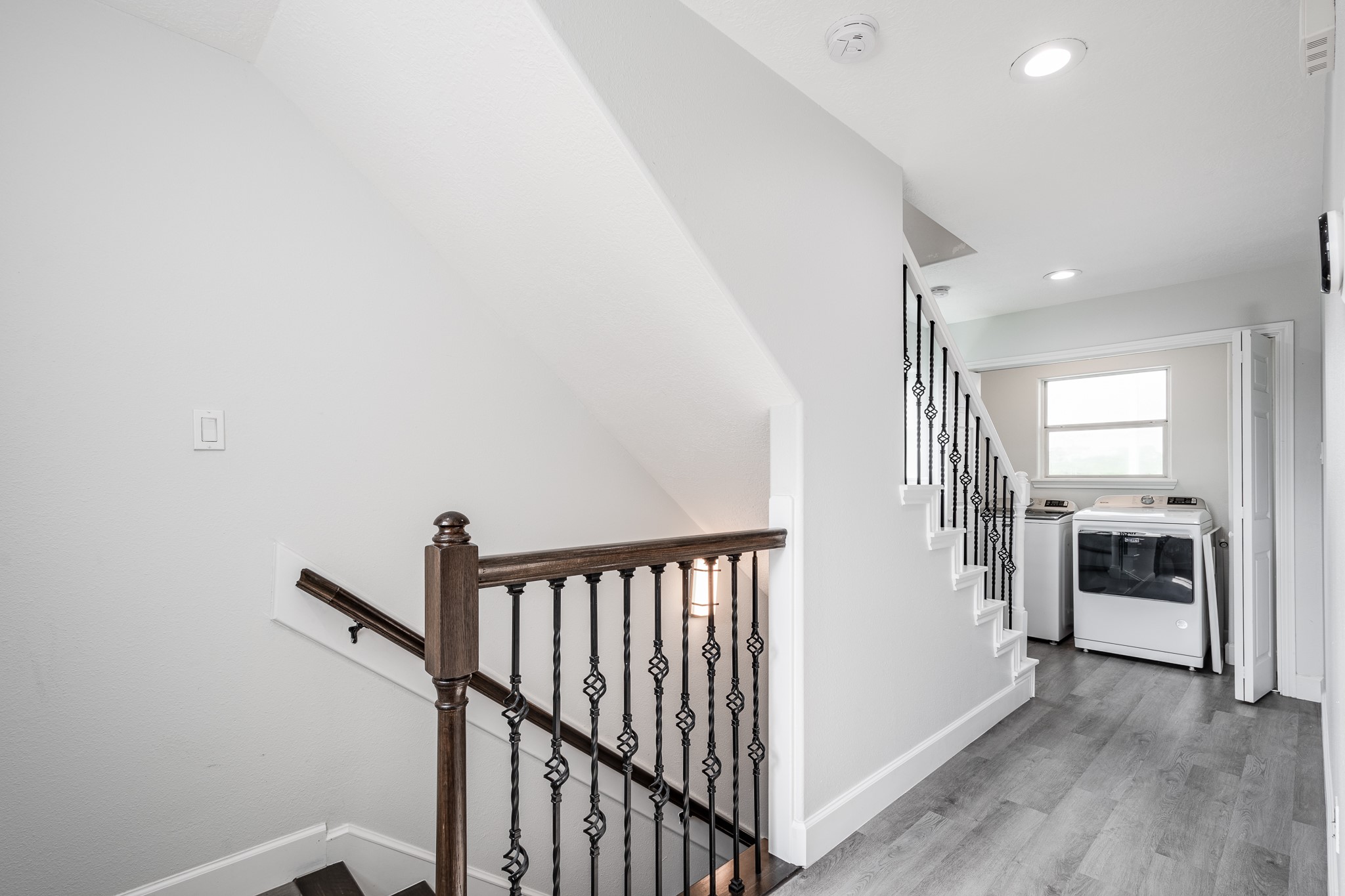 9026 McGallion Road Houston, TX 77022 - Photo 27 of 34 a view of a hallway with a kitchen space