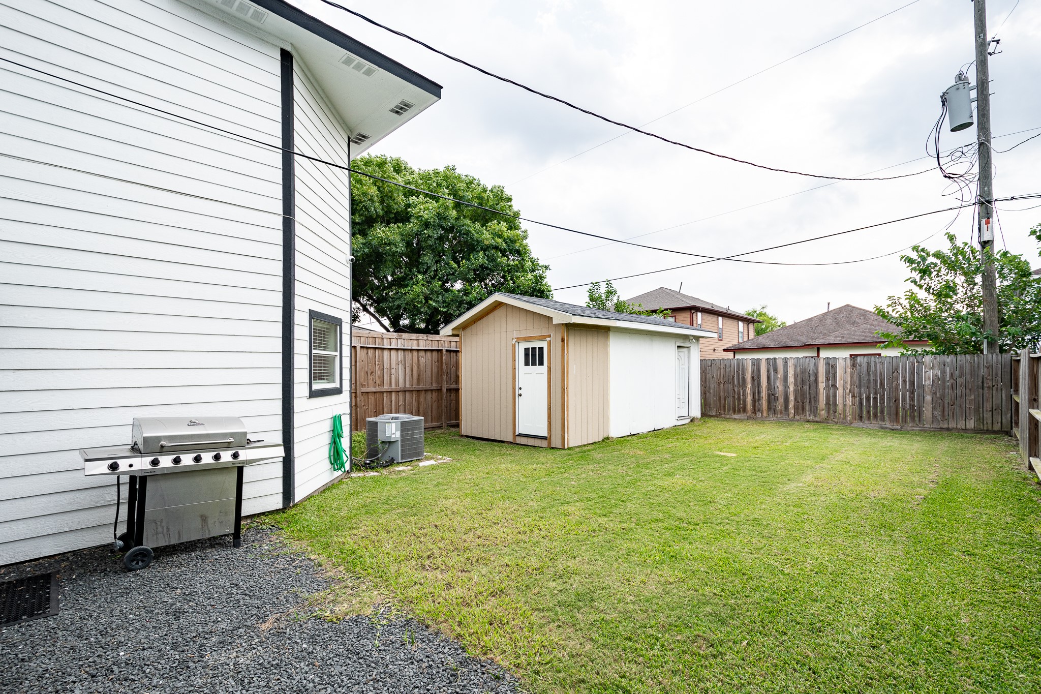 9026 McGallion Road Houston, TX 77022 - Photo 33 of 34 a view of a backyard with wooden fence