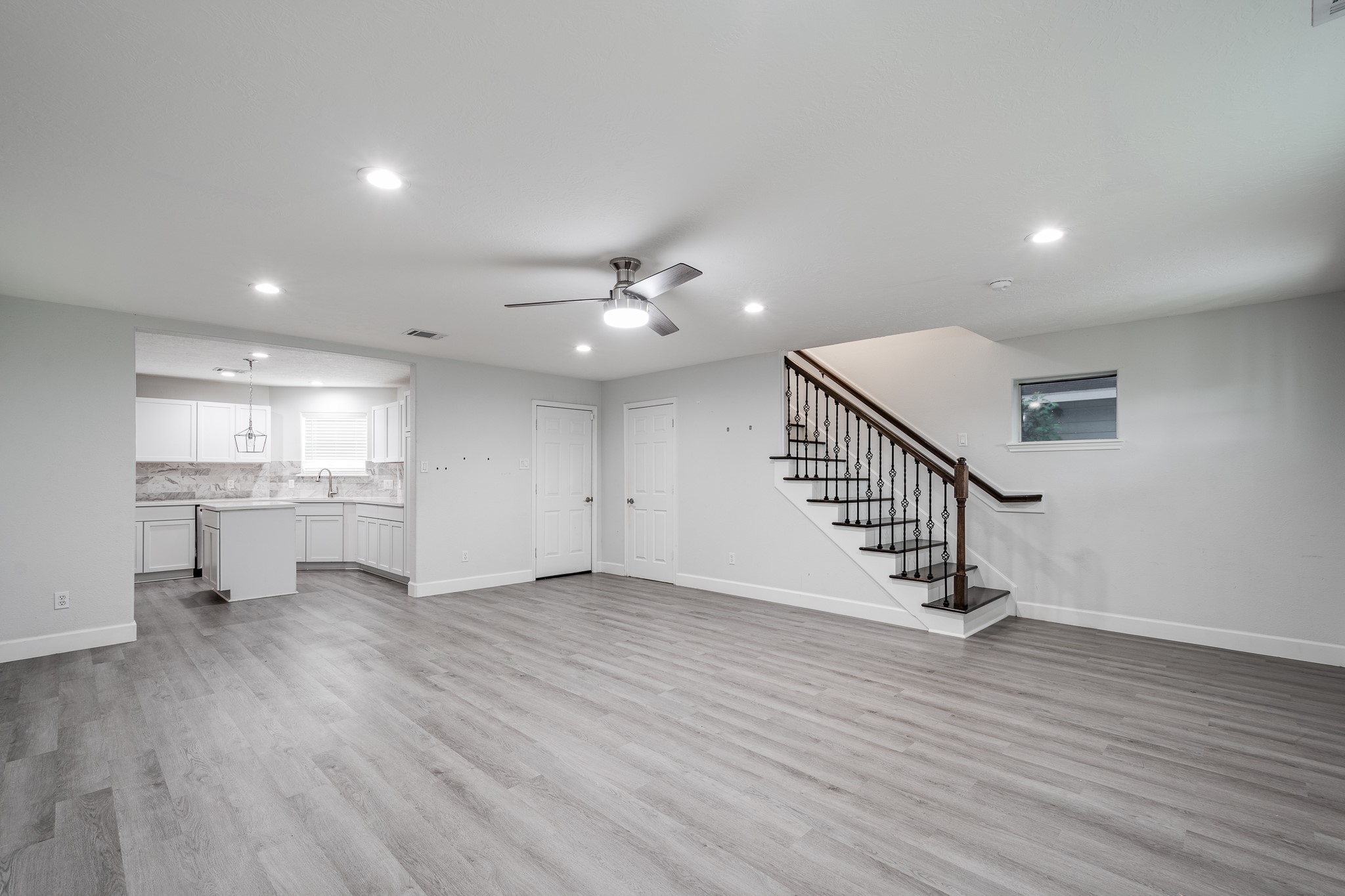 9026 McGallion Road Houston, TX 77022 - Photo 7 of 34 a view of a hallway with wooden floor