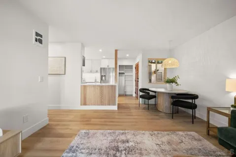 a view of a living room and dining room
