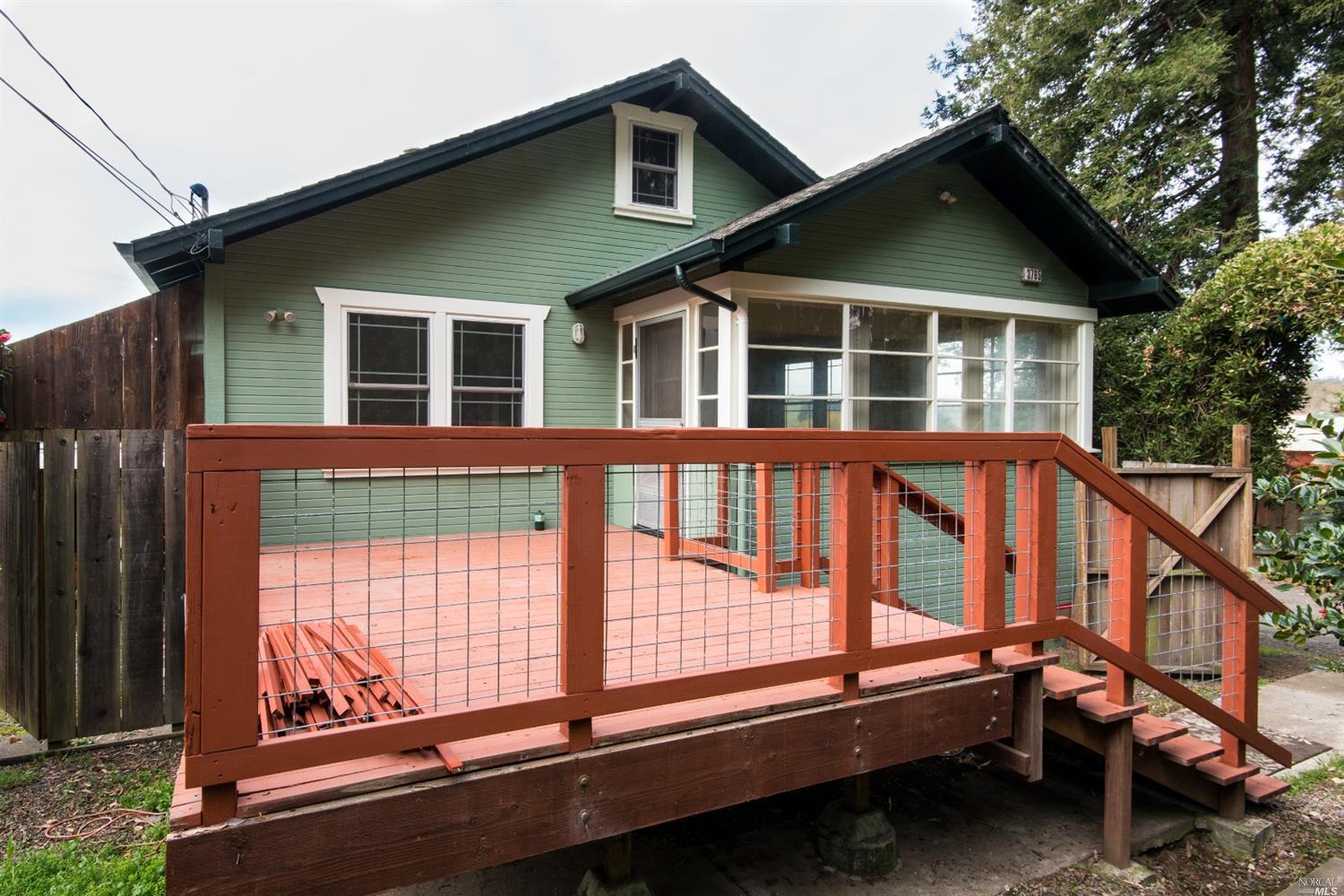 3795 Roblar Road Petaluma, CA 94952 - Photo 1 of 1 a porch with a bench next to a yard