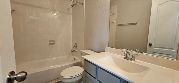 a bathroom with a sink a toilet and a bathtub