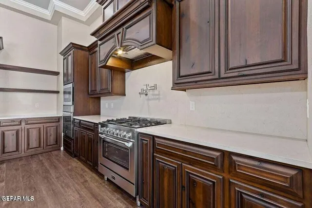 a bathroom with a granite countertop sink a toilet and a mirror