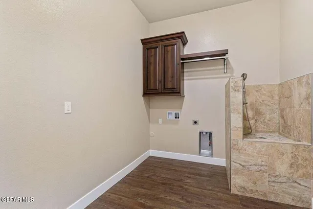 a bedroom with a bed and a potted plant