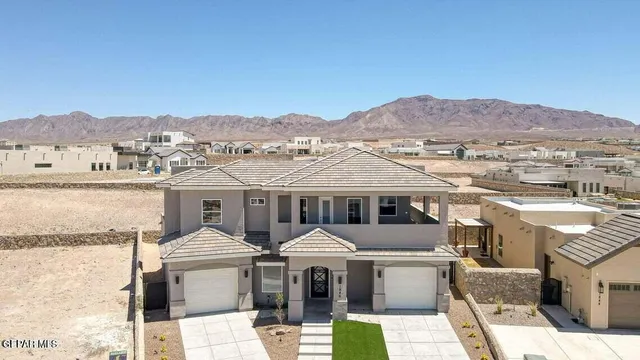 an aerial view of a couch with wooden floor