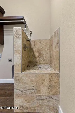 a view of a house with a snow in front of yard