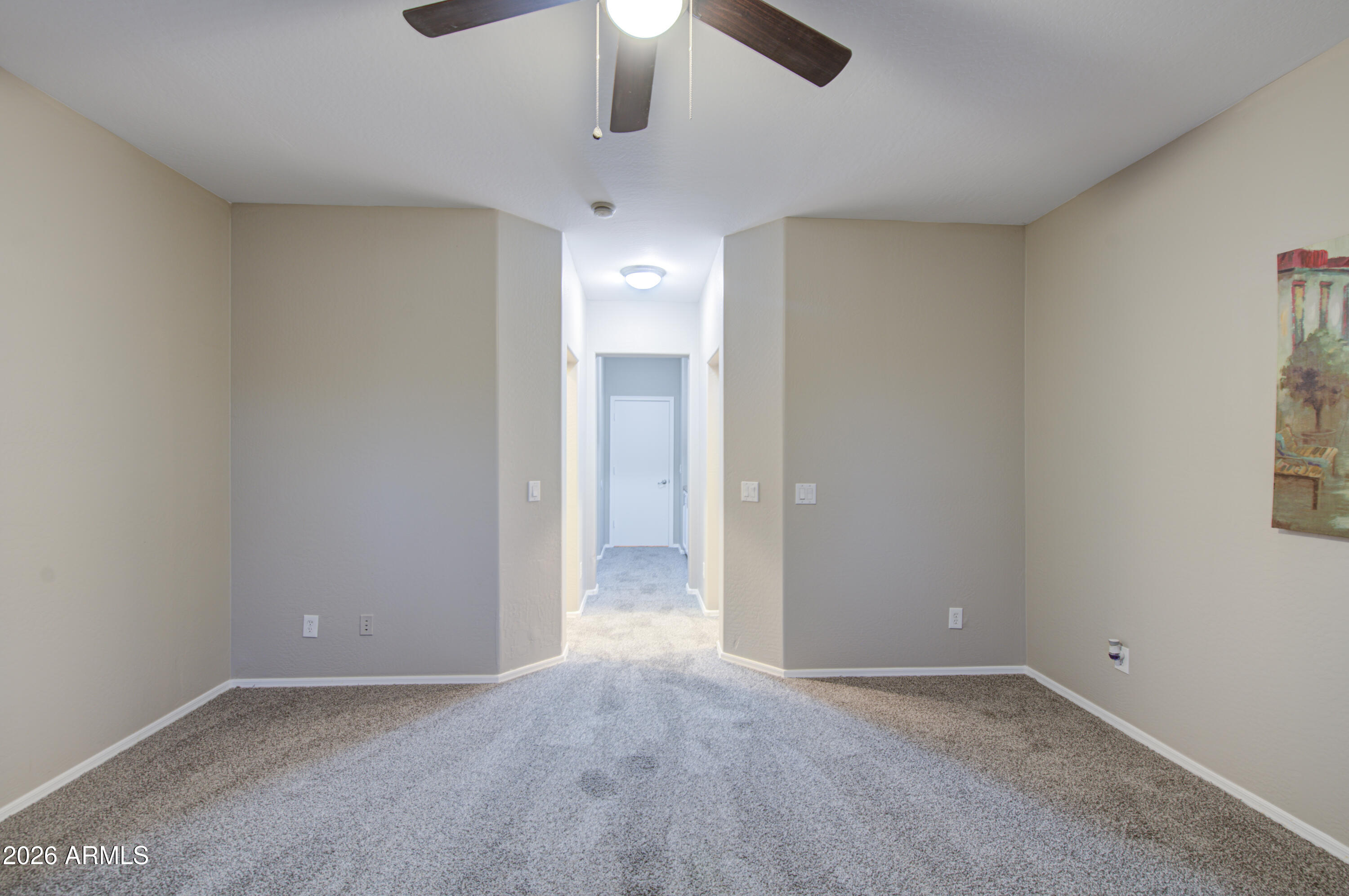 7759 West Monte Vista Road Phoenix, AZ 85035 - Photo 22 of 43 an empty room with a ceiling fan and a window