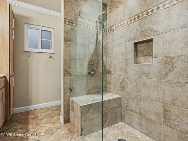 a bathroom with a shower and a sink