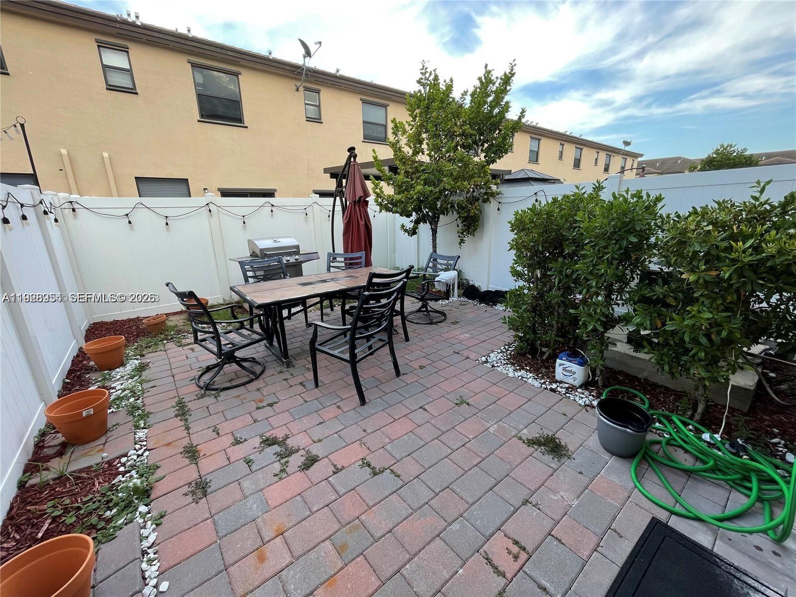 10491 West 34th Court Hialeah, FL 33018 - Photo 21 of 37 a view of a tables and chairs in patio