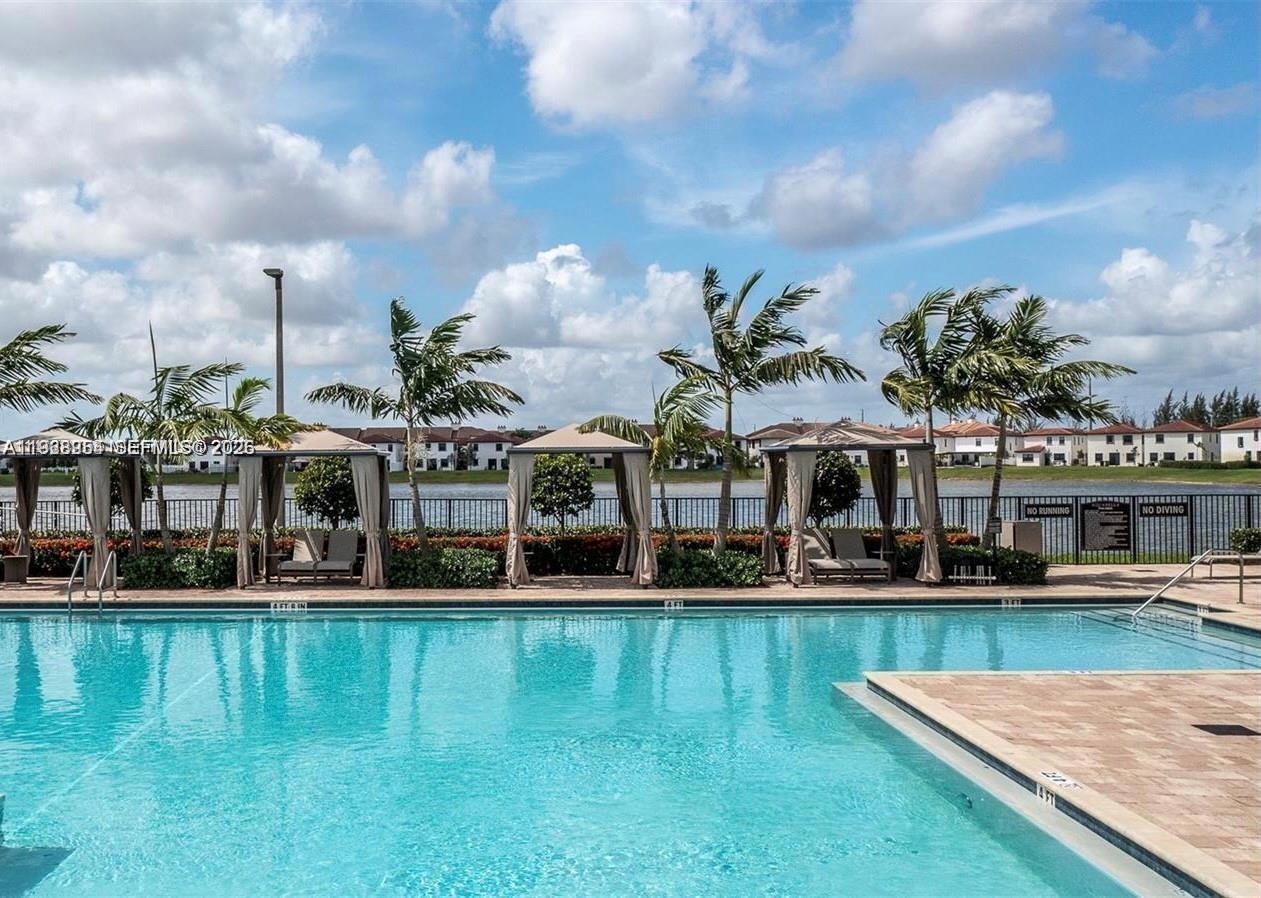 10491 West 34th Court Hialeah, FL 33018 - Photo 25 of 37 a view of a swimming pool with front of house