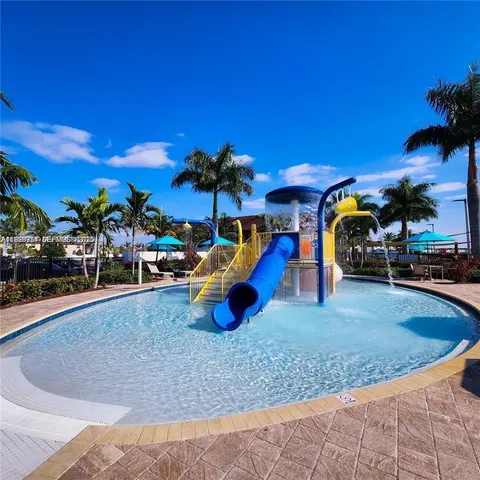 a view of a swimming pool with a yard