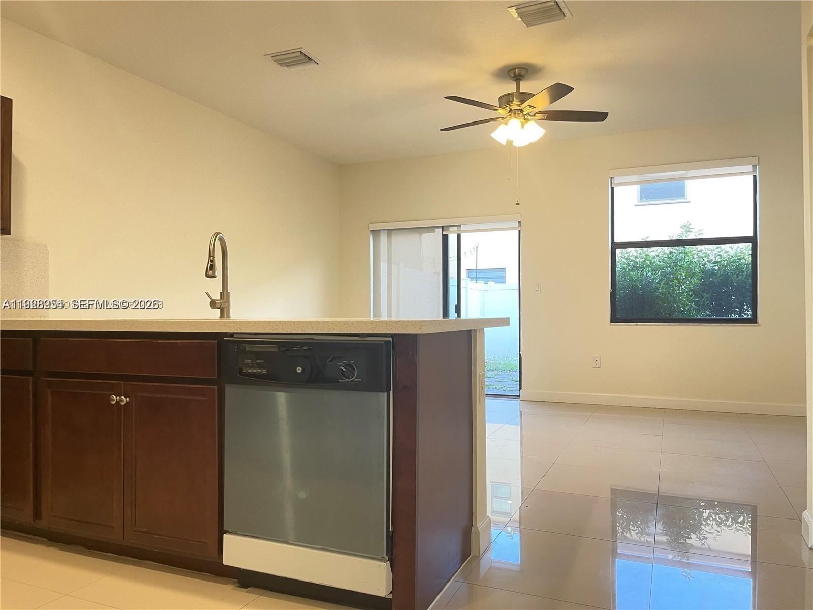 10491 West 34th Court Hialeah, FL 33018 - Photo 8 of 37 a view of a hallway with a chandelier