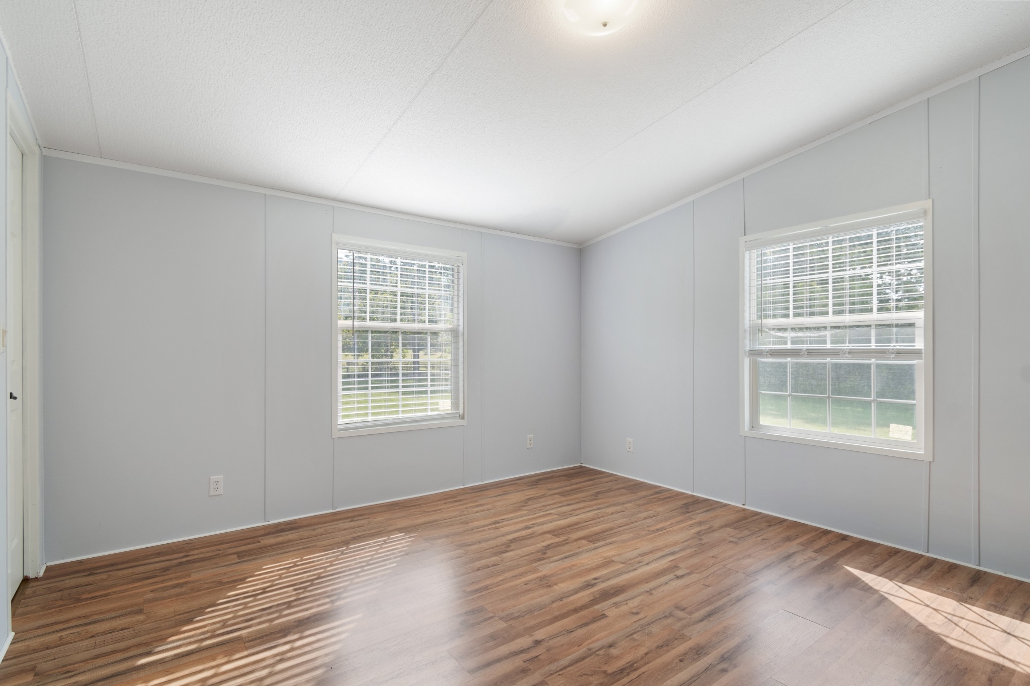 2600 Creecy Hollow Road Pulaski, TN 38478 - Photo 25 of 47 a view of an empty room with wooden floor and a window