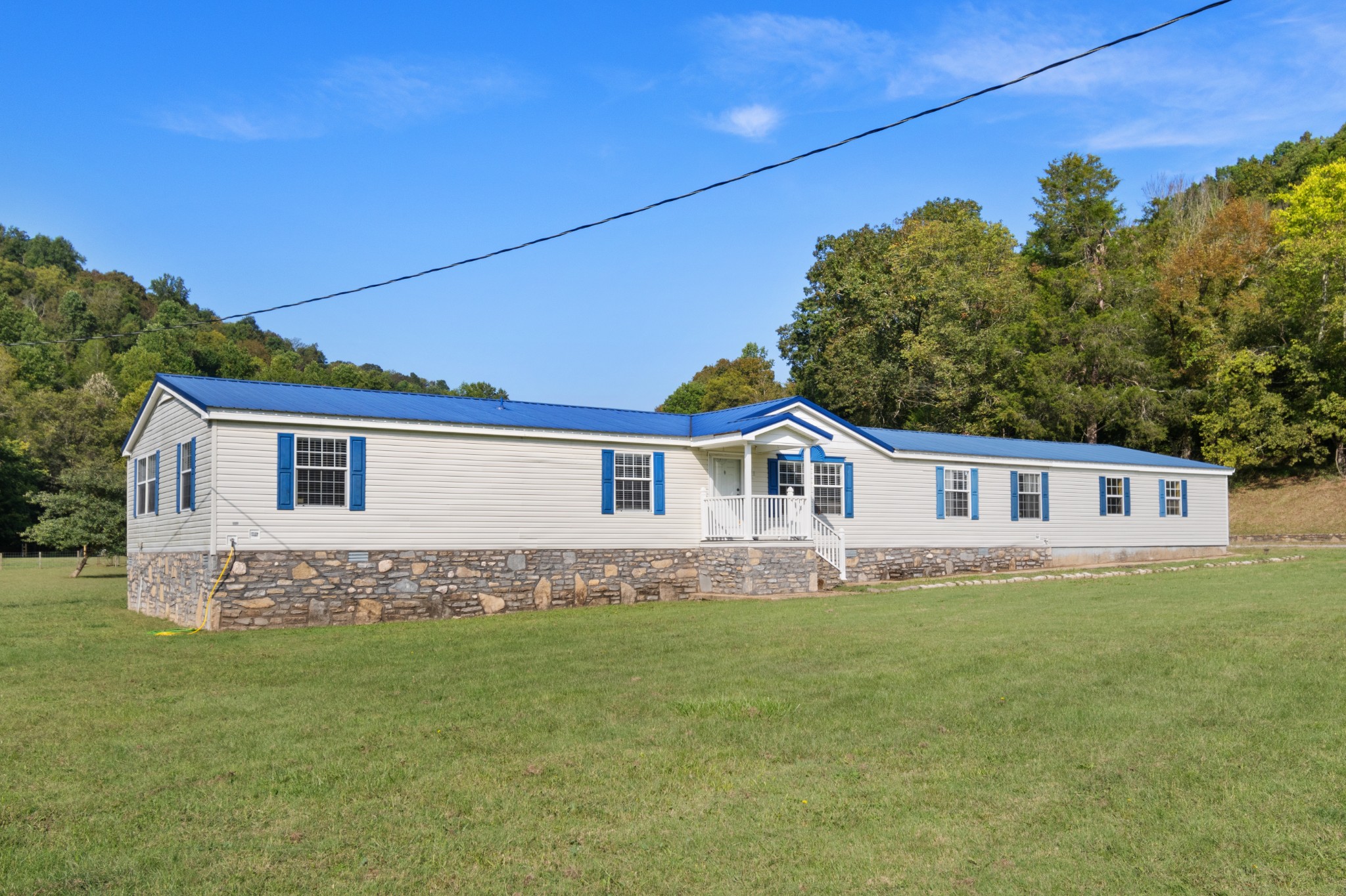 2600 Creecy Hollow Road Pulaski, TN 38478 - Photo 4 of 47 a front view of a house with a garden
