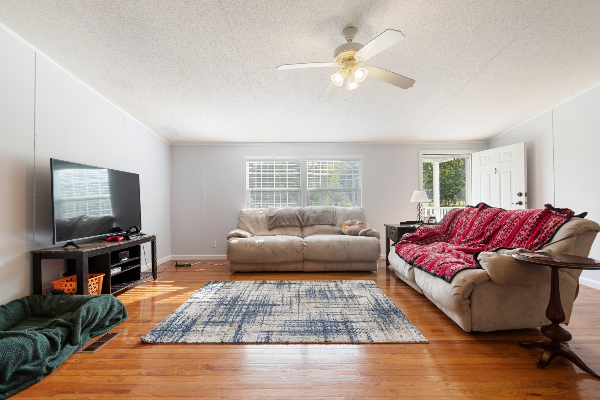 2600 Creecy Hollow Road Pulaski, TN 38478 - Photo 10 of 47 a living room with a couch and a flat screen tv