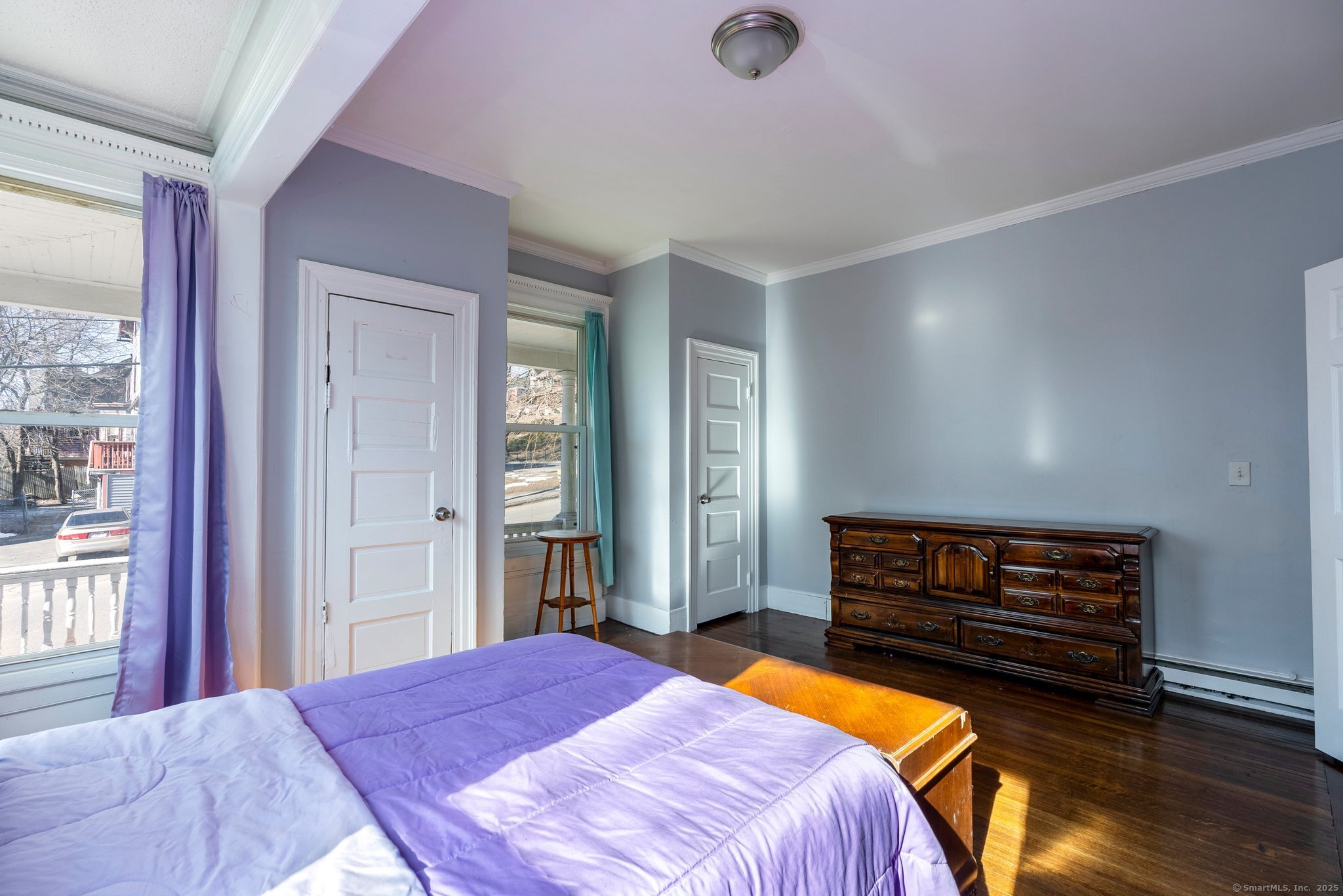 160 Prospect Street, Unit 1 Waterbury, CT 06710 - Photo 12 of 13 a bedroom with a bed and a dresser