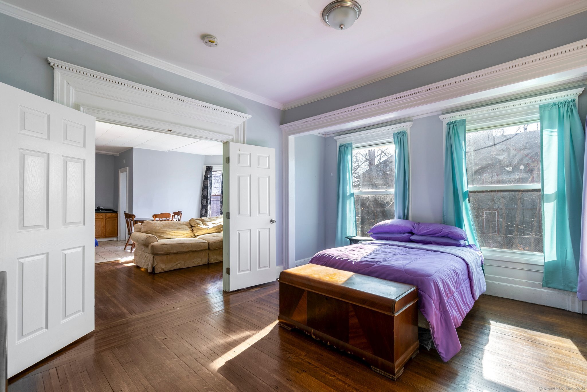 160 Prospect Street, Unit 1 Waterbury, CT 06710 - Photo 13 of 13 a spacious bedroom with a bed and a wooden floor