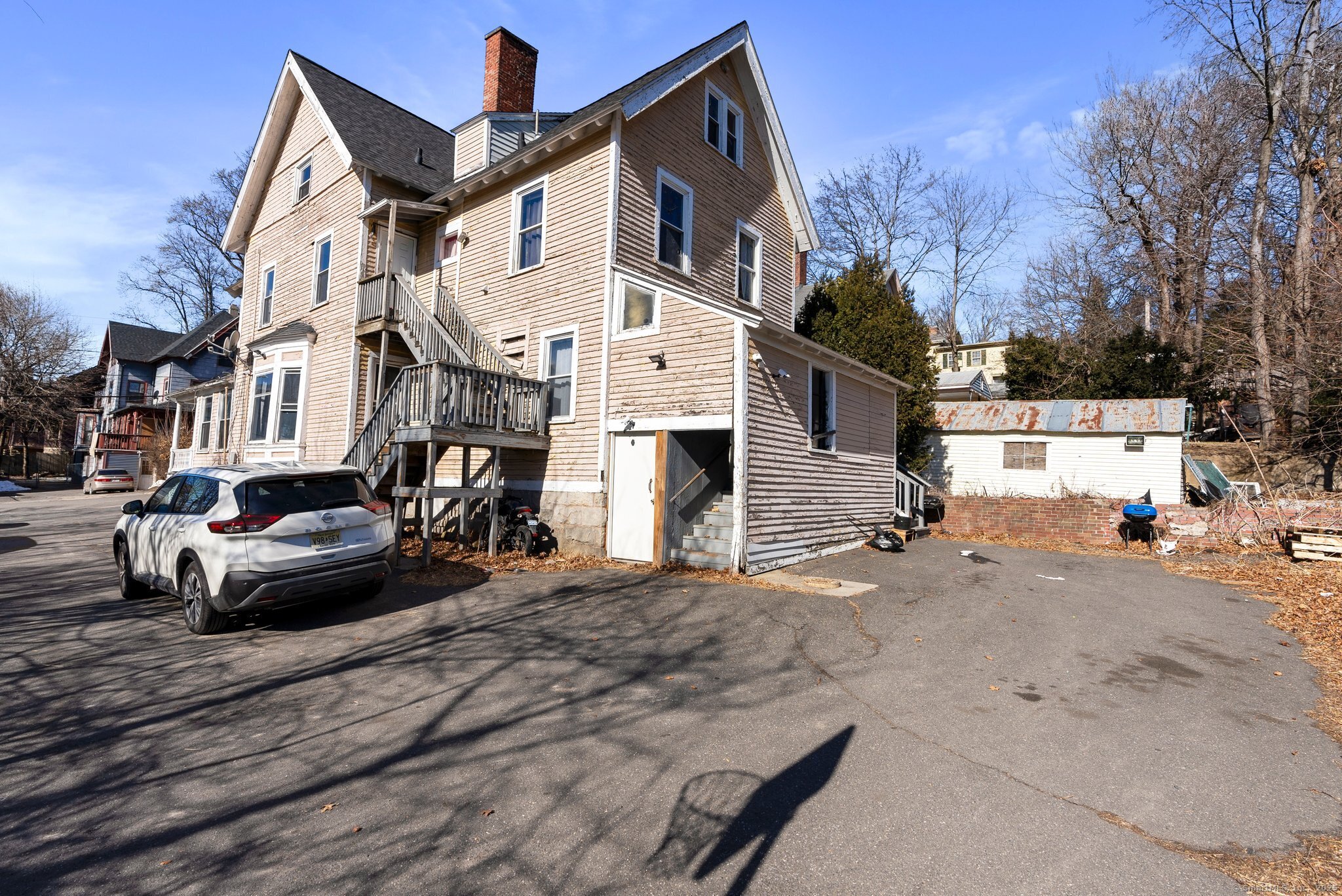 160 Prospect Street, Unit 1 Waterbury, CT 06710 - Photo 2 of 13 a view of a street with cars