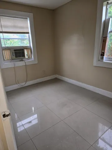 a view of a room that has a window in it