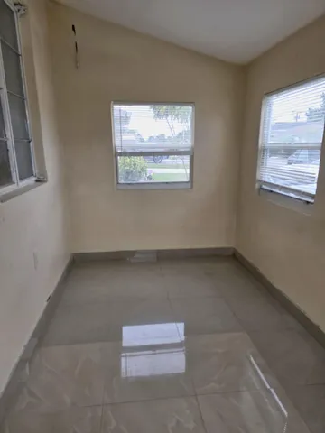 a view of an empty room with entryway