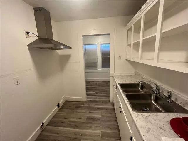 a kitchen with a sink and cabinets