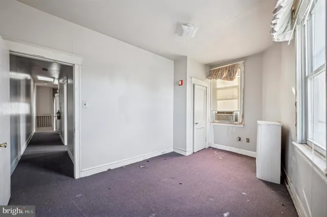 an empty room with windows