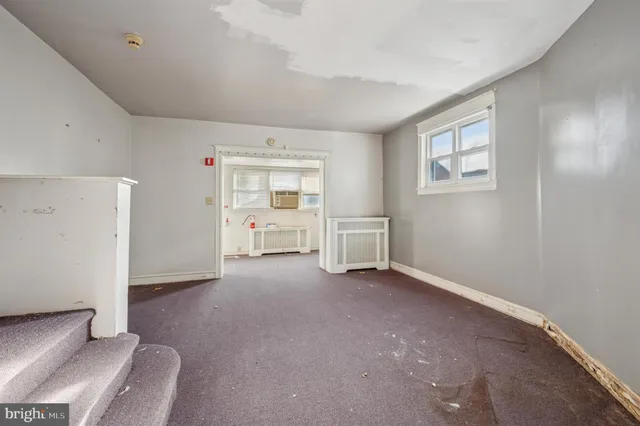 a view of livingroom with furniture and cabinet