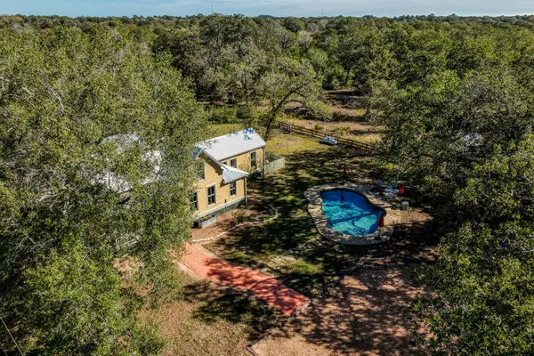 a aerial view of residential house with green space