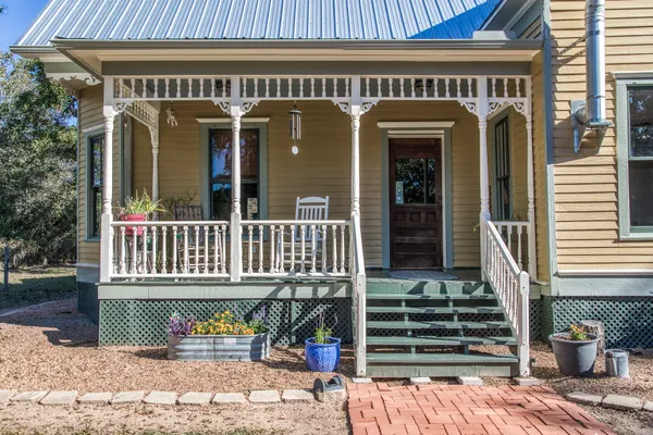 a view of a brick house with large windows