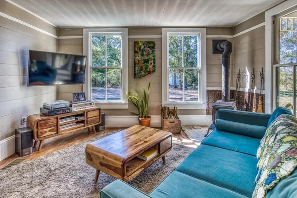 a living room with furniture and a flat screen tv