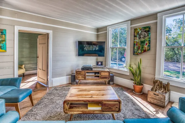 a living room with furniture and a window