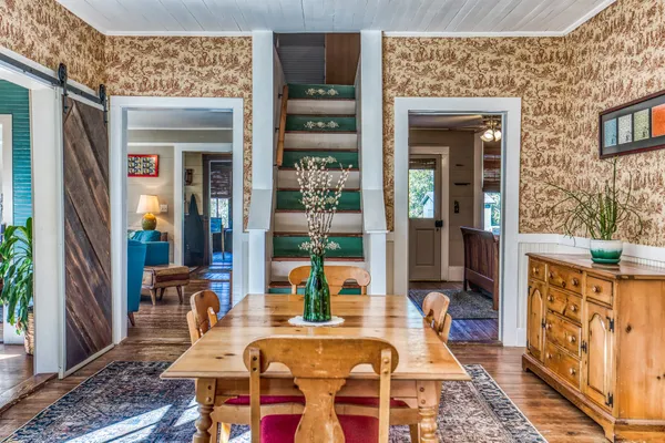 a dining room with furniture and window