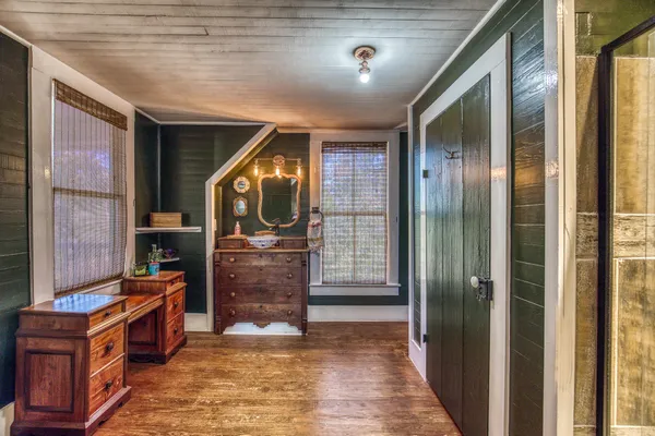 a bathroom with a glass shower door