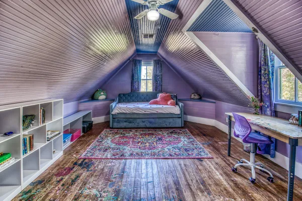 a living room with furniture cabinets and window